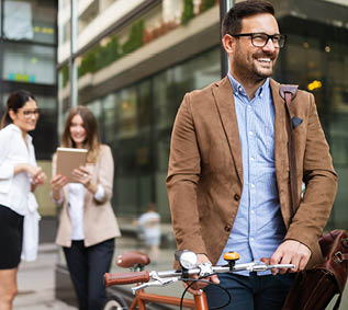 Businessman riding bicycle to work in morning. Way to office.